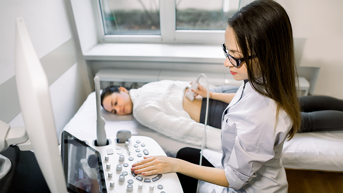 Diganostic Medical Sonographer professional completing a routine test on a patient